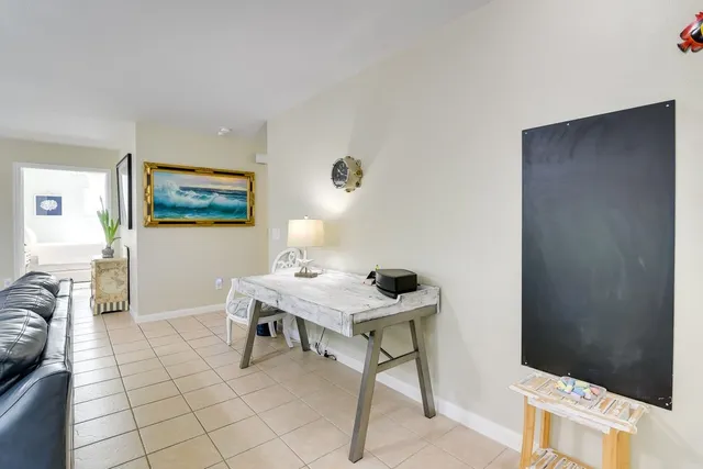 a workspace with furniture and window