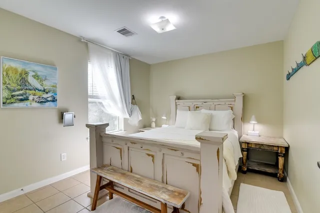 a bedroom with a bed and a table in it