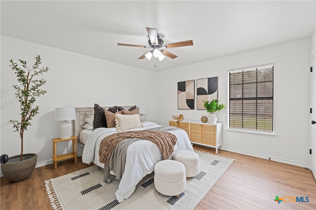 34 Golden Poppy Loop Belton, TX 76513 - Photo 17 of 27 a bed room with a bed furniture and a window
