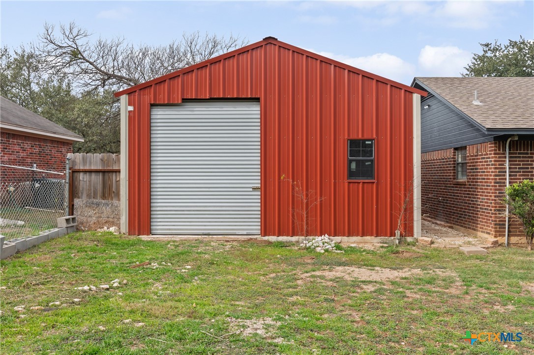 34 Golden Poppy Loop Belton, TX 76513 - Photo 23 of 27 a front view of house with garage