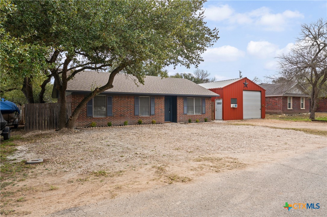 34 Golden Poppy Loop Belton, TX 76513 - Photo 26 of 27 a front view of a house with a yard