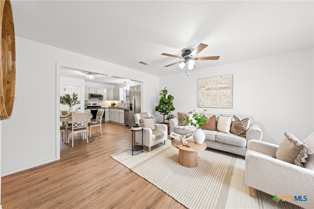 34 Golden Poppy Loop Belton, TX 76513 - Photo 4 of 27 a living room with furniture and view of kitchen