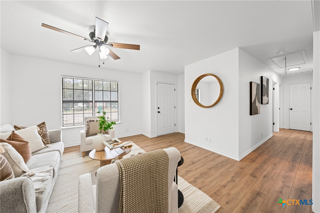 34 Golden Poppy Loop Belton, TX 76513 - Photo 7 of 27 a living room with furniture chandelier and a window