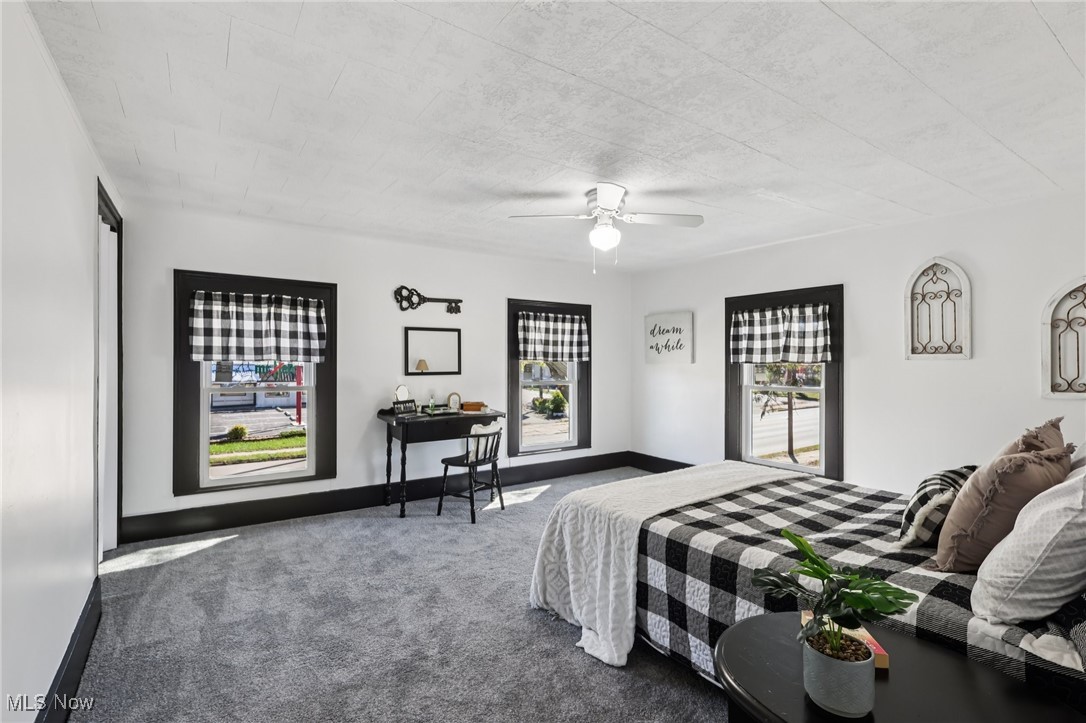 1743 West Prospect Road Ashtabula, OH 44004 - Photo 32 of 43 Carpeted bedroom featuring a ceiling fan and baseboards