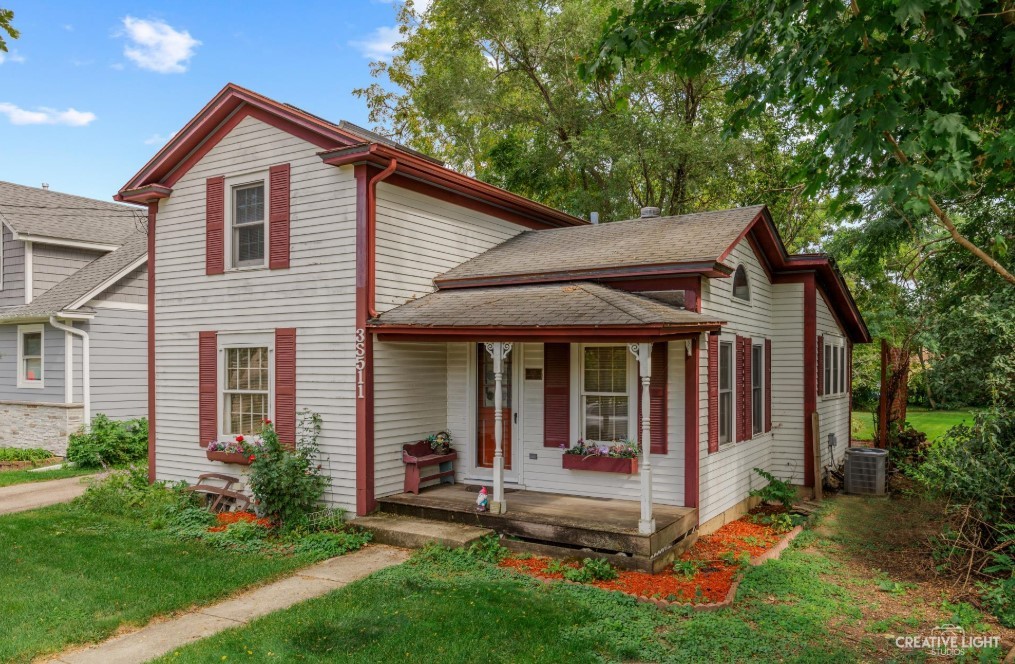 3S511 4th Street Warrenville, IL 60555 - Photo 1 of 36 a view of a house with a yard and large tree