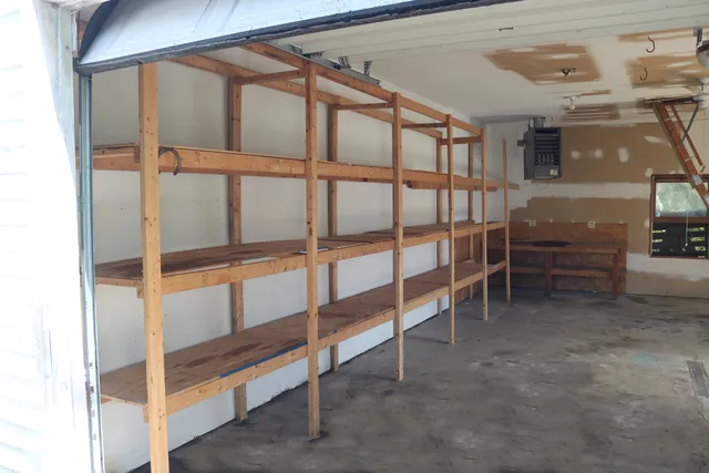 a view of an empty room with cabinet