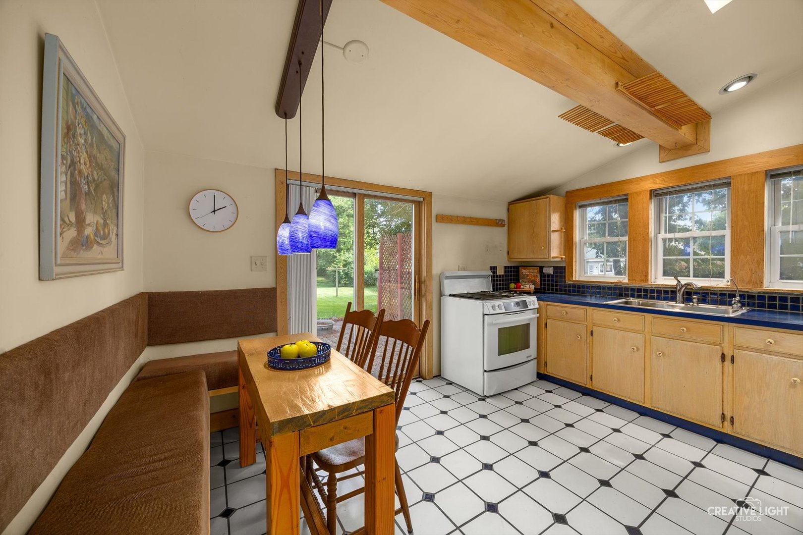 3S511 4th Street Warrenville, IL 60555 - Photo 6 of 36 a kitchen with a dining table chairs sink and cabinets