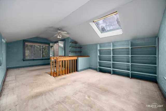 a view of an empty room with a fireplace