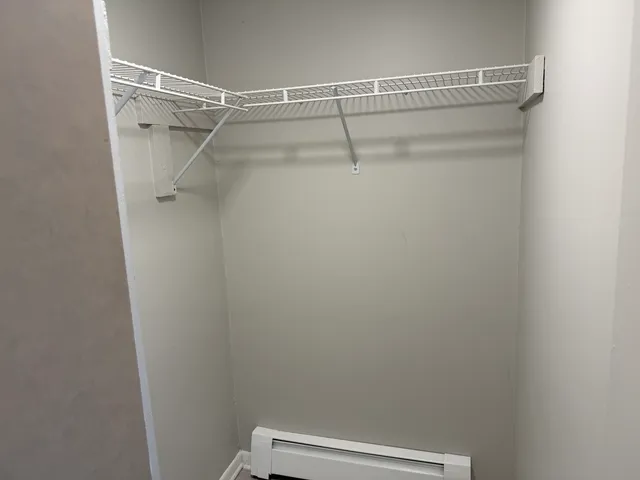 a view of a room with racks on the wall