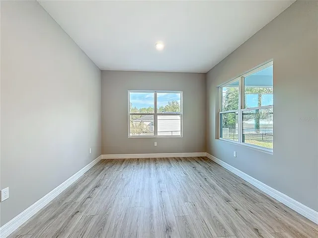 a view of kitchen dining table chairs and kitchen view