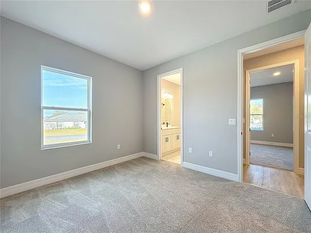 an empty room with closet area