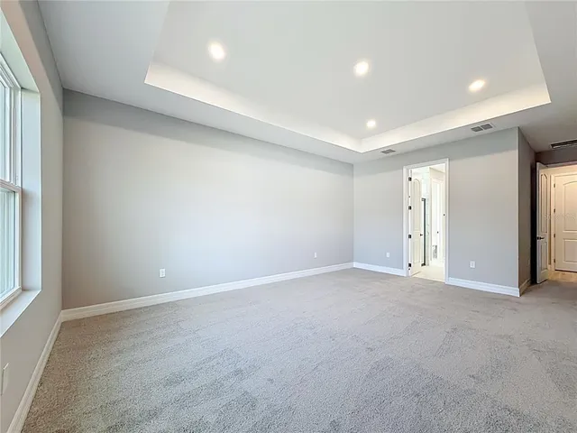 a spacious bathroom with a double vanity sink mirror and shower