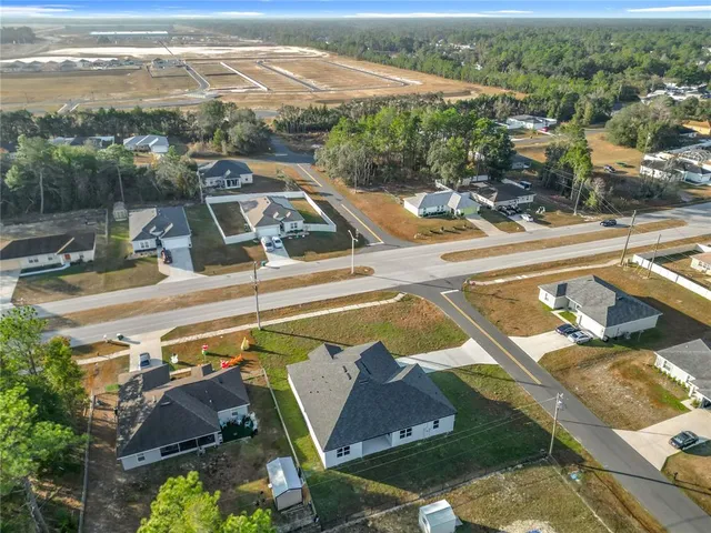 an aerial view of a house with a lake view