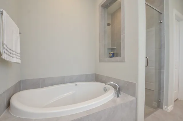 a white bath tub sitting in a bathroom