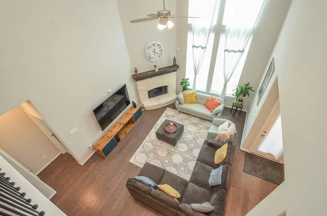 a living room with furniture and a fireplace