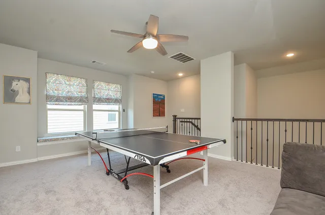 a room with gym equipment and windows