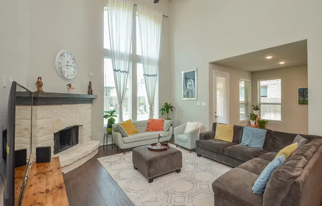 a living room with furniture and a fireplace