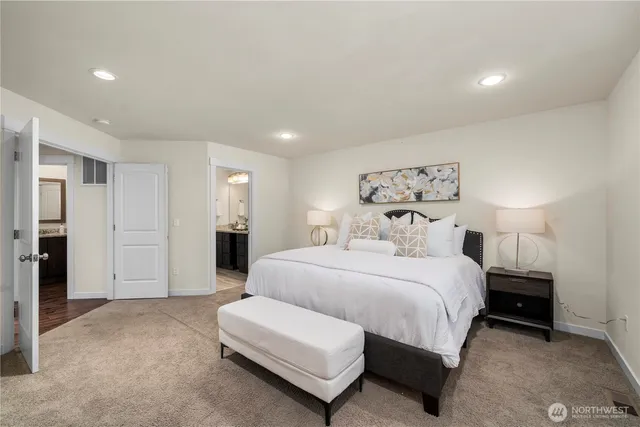 a spacious bedroom with a bed and closet