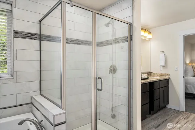 a bathroom with a shower and a sink