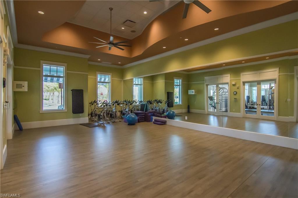 6552 Dominica Drive, Unit 101 Naples, FL 34113 - Photo 36 of 50 a lobby with furniture and wooden floor