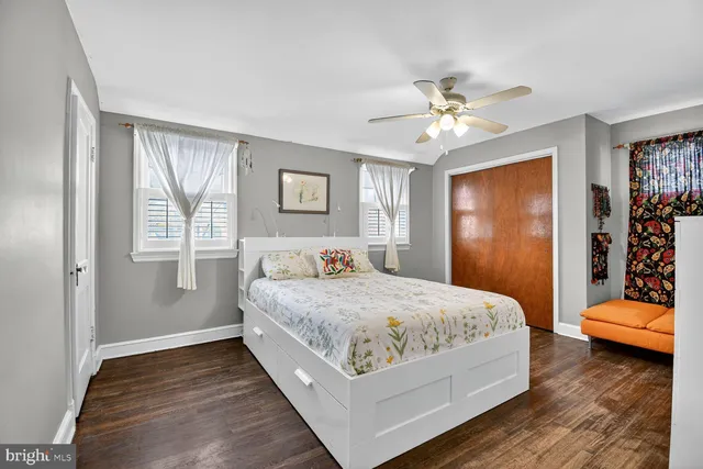 a bedroom with a bed and a closet