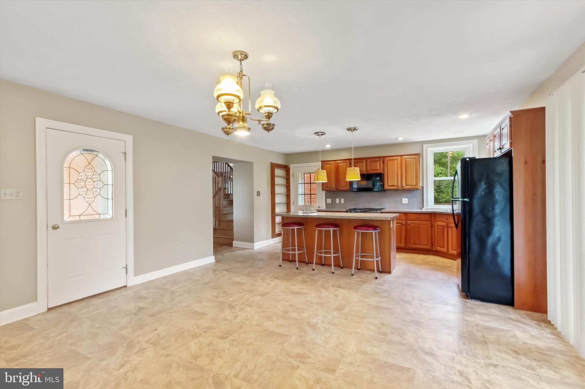 8219 Lehman Road Dallastown, PA 17313 - Photo 19 of 40 a view of kitchen with refrigerator stove and wooden cabinets