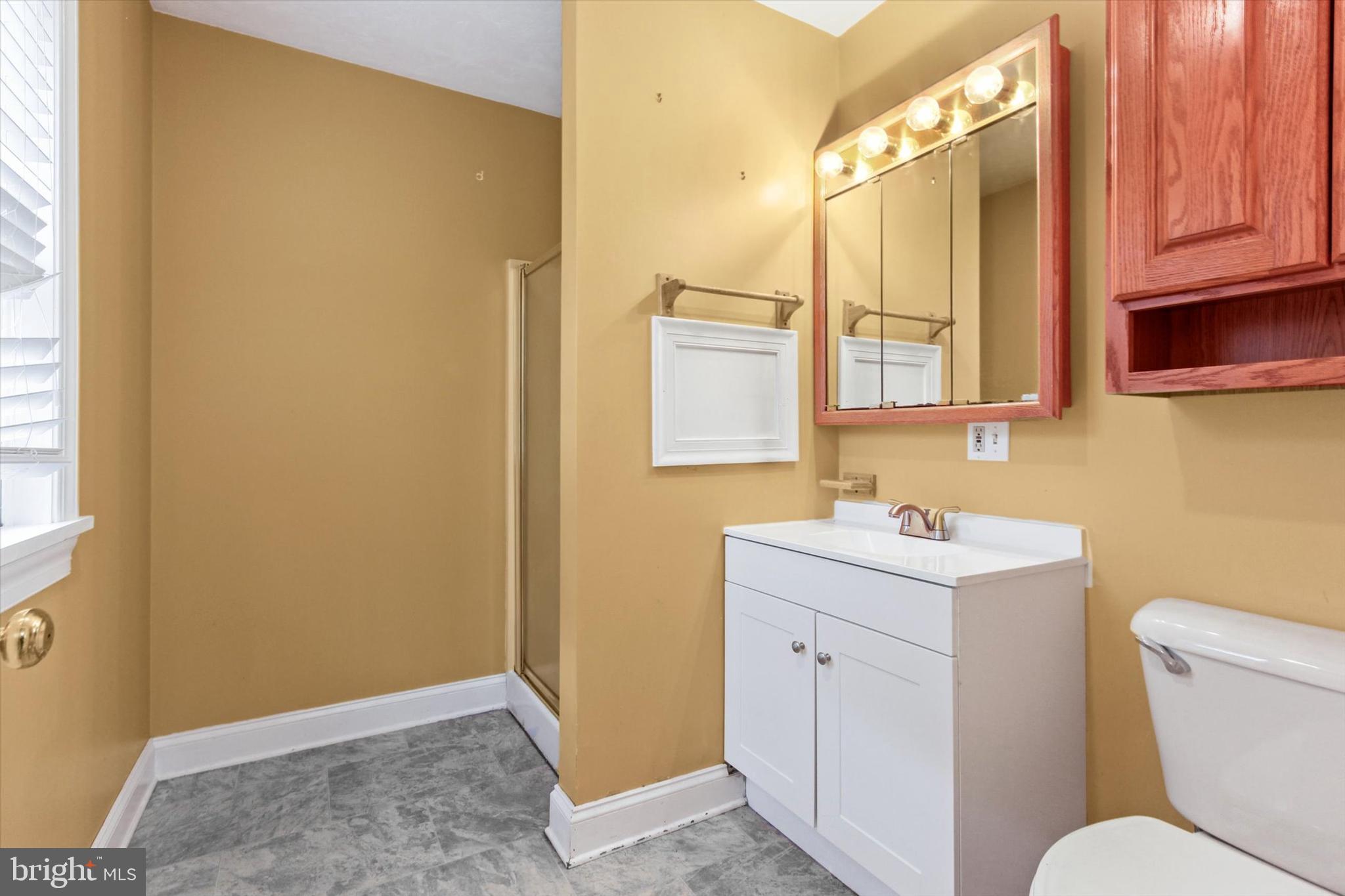 8219 Lehman Road Dallastown, PA 17313 - Photo 23 of 40 a bathroom with a toilet sink and mirror