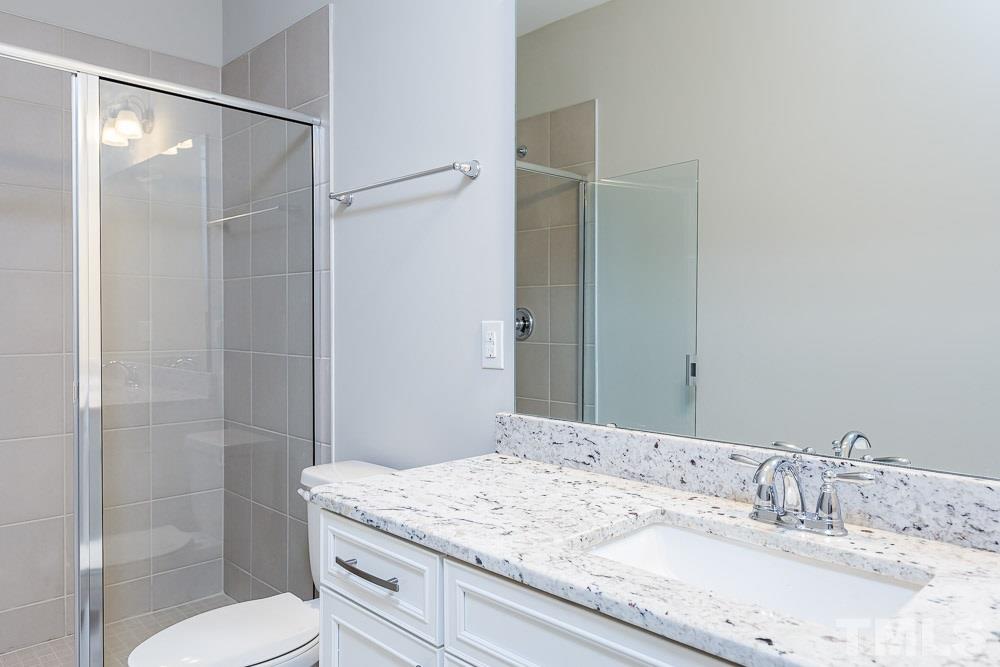 1633 Wimberly Road, Unit 32 Apex, NC 27523 - Photo 19 of 30 1st Floor full bathroom with walk-in shower.