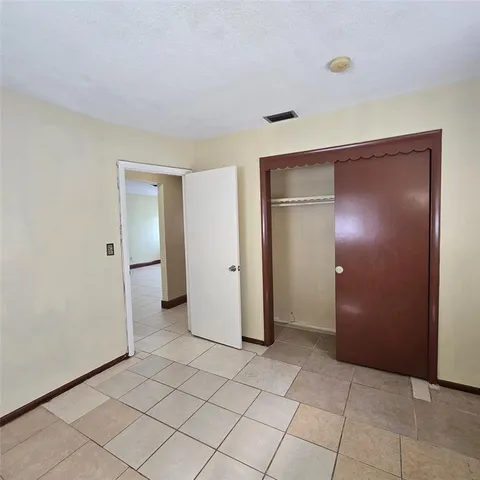 an empty room with closet area