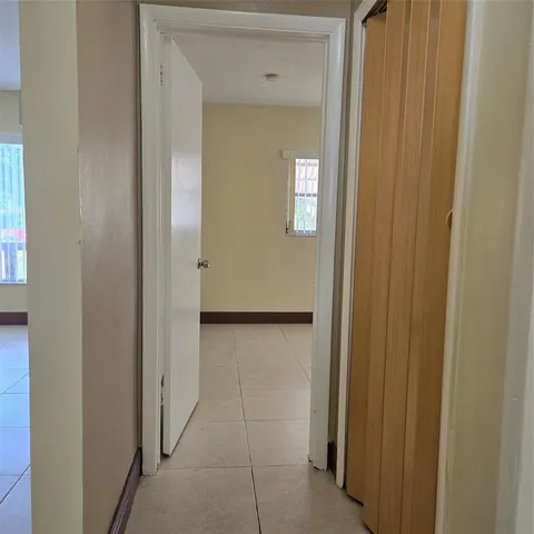 a view of a hallway with front door