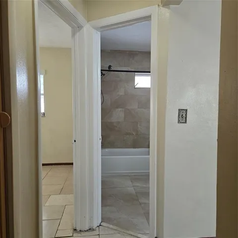 a bathroom with a glass shower door