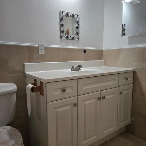 a bathroom with a sink and a toilet