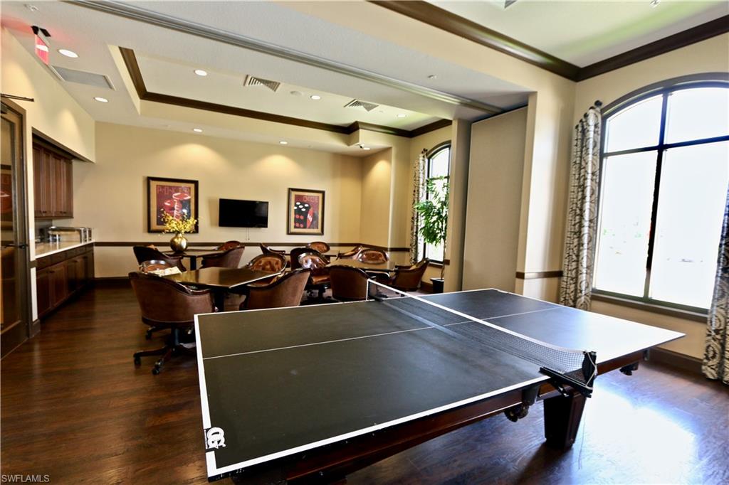 8437 Rosa Court Naples, FL 34114 - Photo 27 of 32 a view of a dining room with furniture and wooden floor