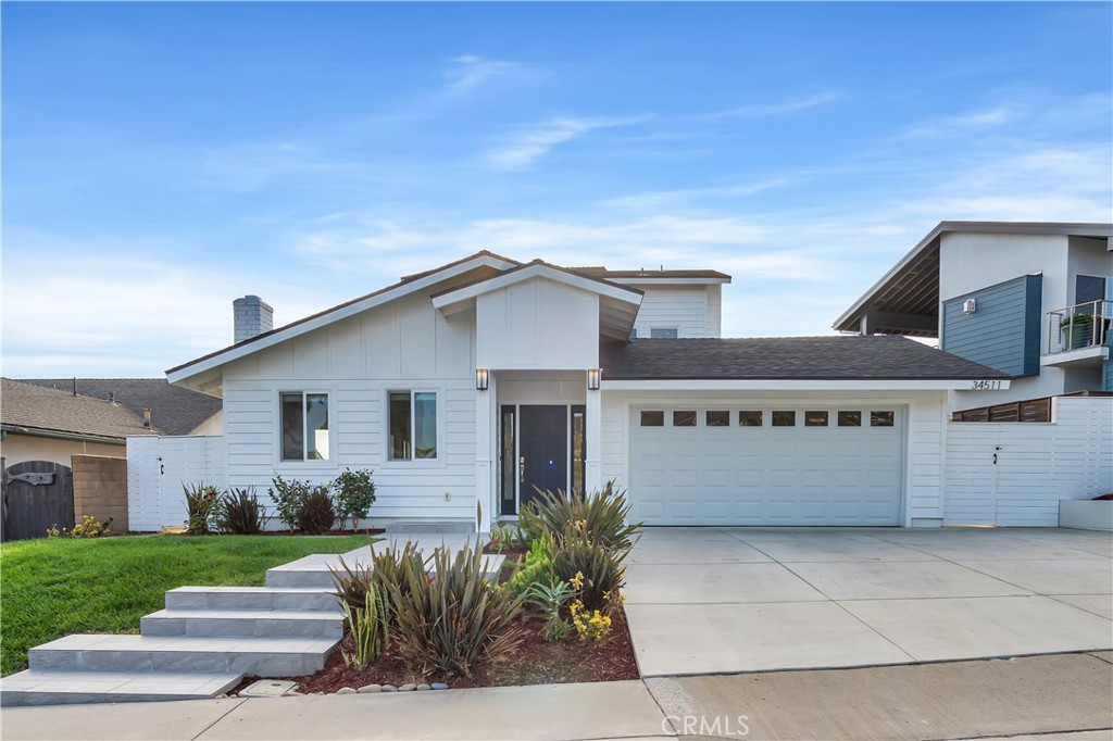 34511 Calle Monte Dana Point, CA 92624 - Photo 2 of 57 a front view of a house with a garden