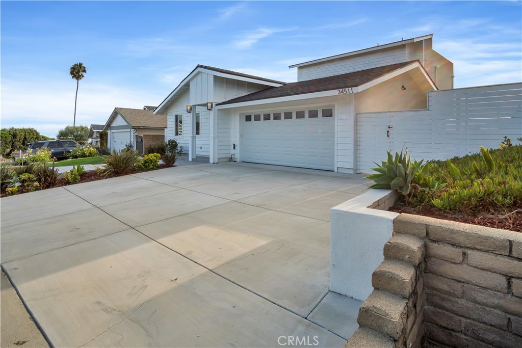 34511 Calle Monte Dana Point, CA 92624 - Photo 21 of 57 a front view of a house with garden