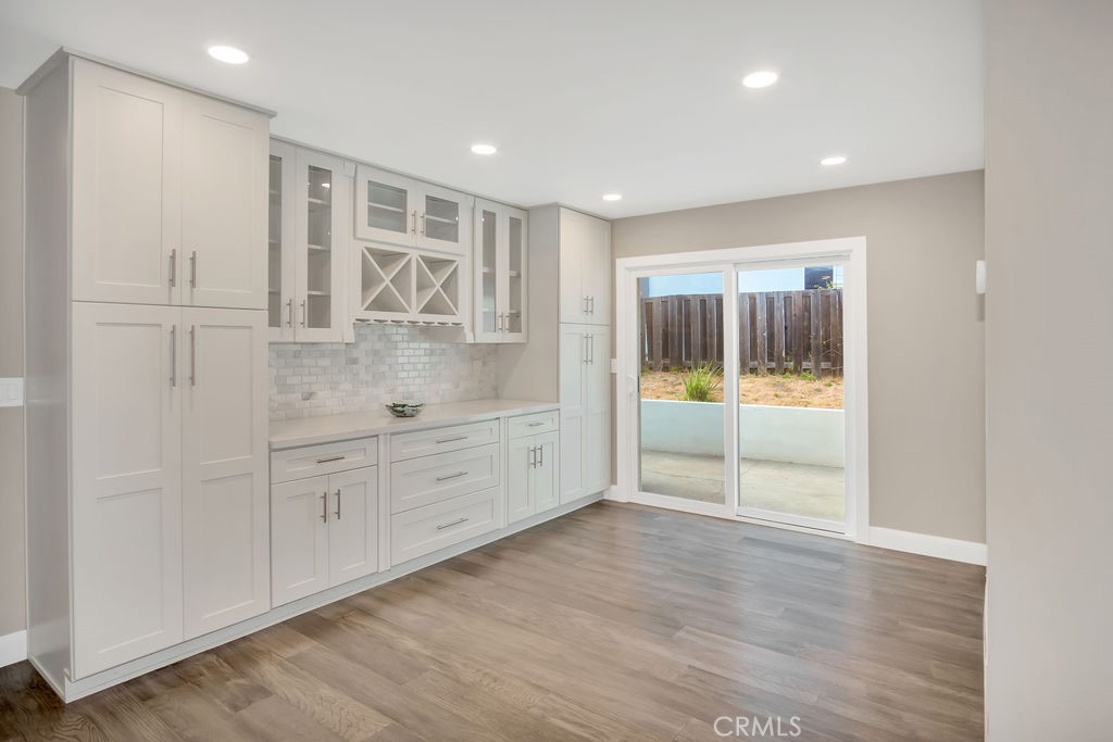 34511 Calle Monte Dana Point, CA 92624 - Photo 29 of 57 a view of a hallway with wooden floor and windows