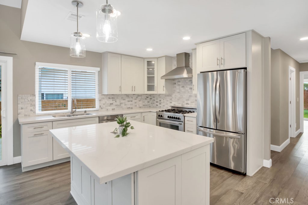 34511 Calle Monte Dana Point, CA 92624 - Photo 30 of 57 a kitchen with stainless steel appliances a refrigerator a sink a stove a microwave and island