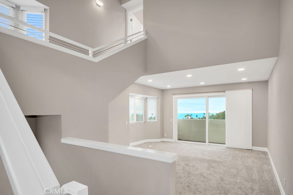 34511 Calle Monte Dana Point, CA 92624 - Photo 44 of 57 a view of an empty room with wooden floor and a window