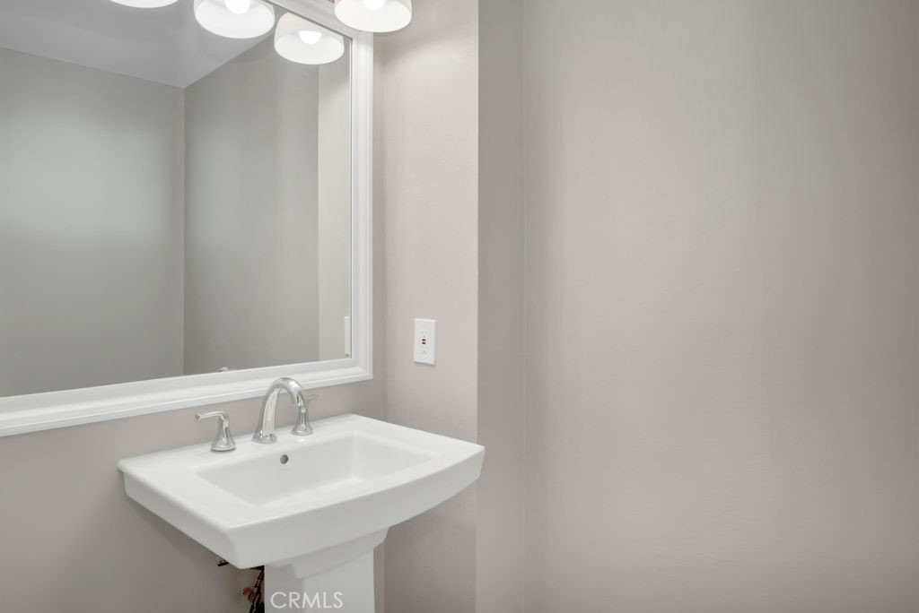 34511 Calle Monte Dana Point, CA 92624 - Photo 47 of 57 a bathroom with a sink and a mirror