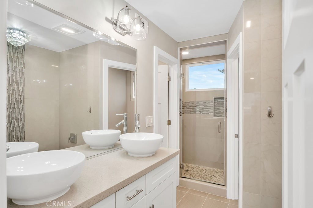 34511 Calle Monte Dana Point, CA 92624 - Photo 51 of 57 a bathroom with a sink a toilet and shower