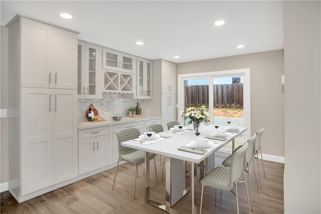 34511 Calle Monte Dana Point, CA 92624 - Photo 7 of 57 a kitchen with a sink dining table and chairs