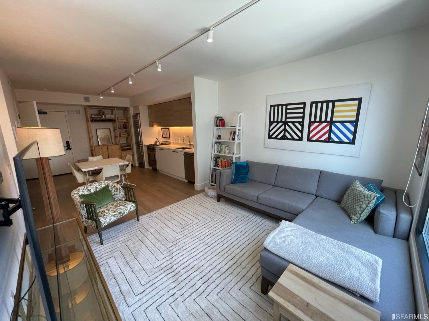 Larkin Street San Francisco, CA 94109 - Photo 1 of 24 a living room with furniture and a wooden floor