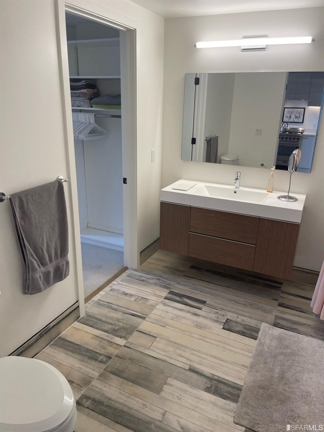 Larkin Street San Francisco, CA 94109 - Photo 11 of 24 a bathroom with a sink and mirror