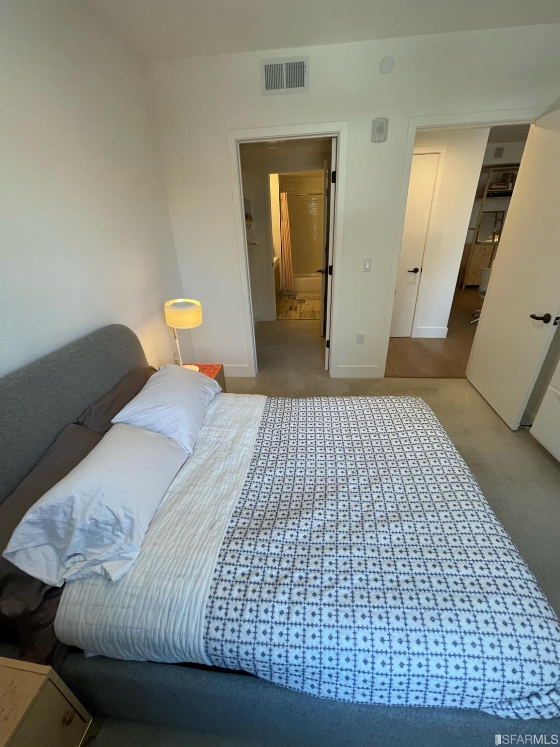 Larkin Street San Francisco, CA 94109 - Photo 16 of 24 a bedroom with a bed and a mirror