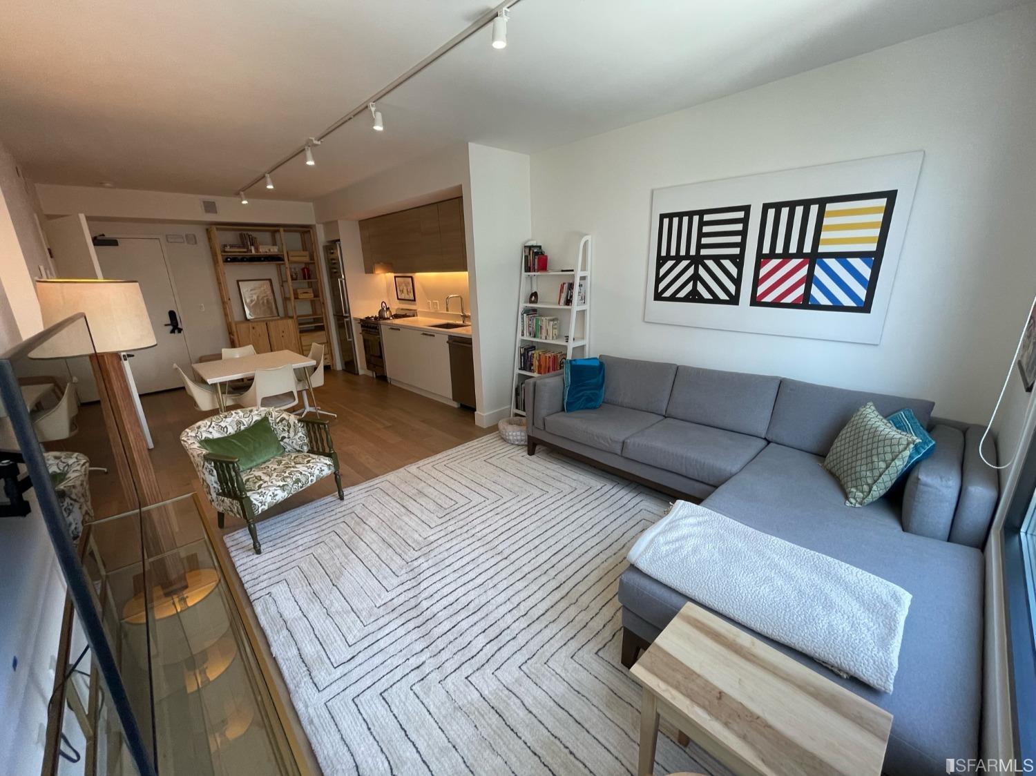 Larkin Street San Francisco, CA 94109 - Photo 2 of 24 a living room with furniture and wooden floor