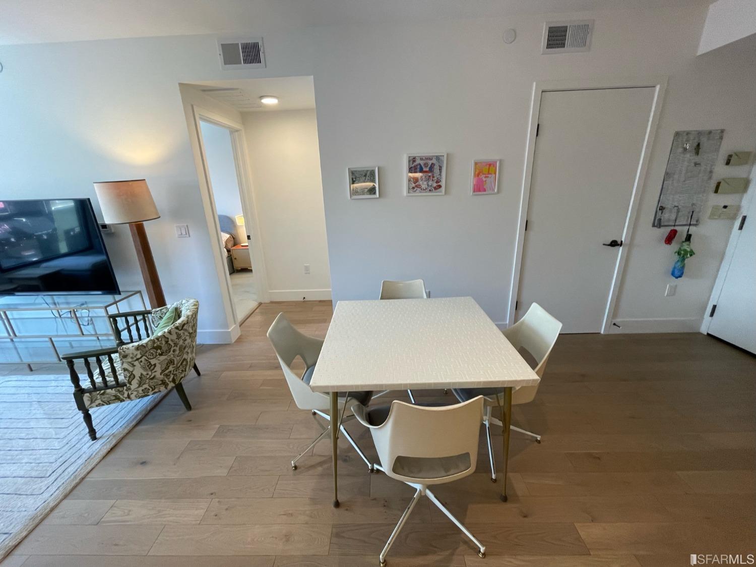 Larkin Street San Francisco, CA 94109 - Photo 8 of 24 a view of a dining room with furniture and wooden floor