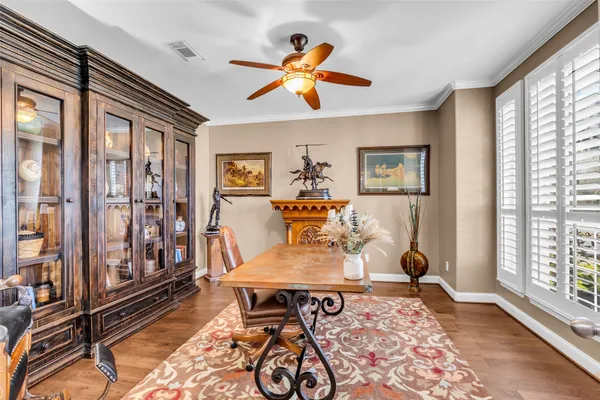 a living room with furniture a rug and a large window