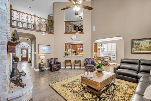 a kitchen with stainless steel appliances granite countertop a stove refrigerator and cabinets