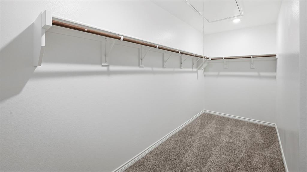 403 Flintlock Road Caddo Mills, TX 75135 - Photo 19 of 26 Walk in closet with attic access and carpet