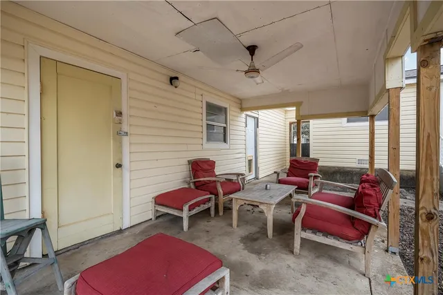a bedroom with furniture and a window